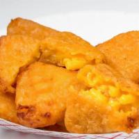 Fried Mac and Cheese Wedges · Just oozing with cheese, delicious, crunchy treat will have your taste buds wanting more.