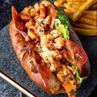Lobster BLT · Seasoned chunks of Maine lobster claws served with thick cut applewood bacon, fresh lettuce ...