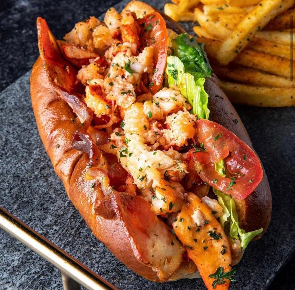 Lobster BLT · Seasoned chunks of Maine lobster claws served with thick cut applewood bacon, fresh lettuce and crisp tomatoes.