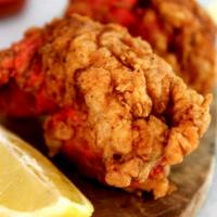 Fried Lobster · Golden breaded Maine lobster chunks served with our seasoned fries.