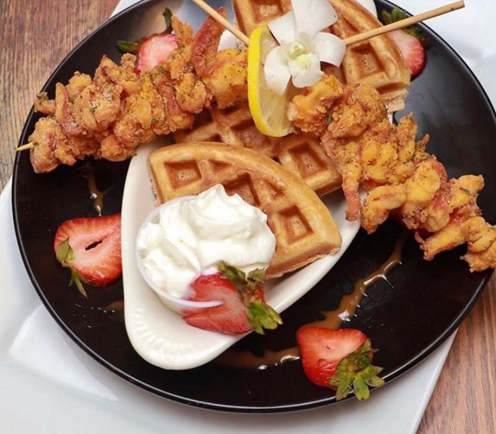 Shrimp & Waffles · Golden breaded fried shrimp on waffles.