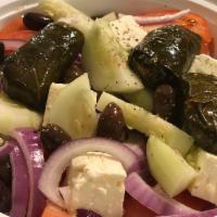 Horiatiki Salad · Tomatoes, feta, olives, cucumbers and onions.