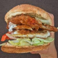Fried Fish Sandwich · Served on a bun with lettuce and tomato, tartar sauce on the side.