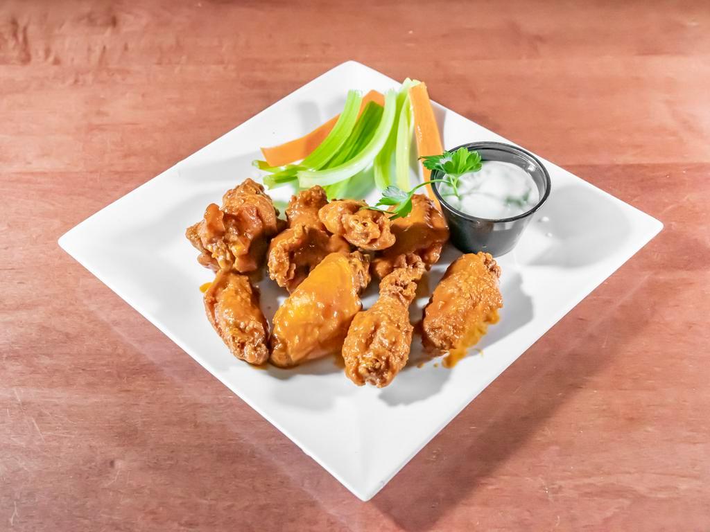  Traditional Buffalo Wings · Fried in a lightly spiced batter spun in your favorite buffalo wing sauce, blue cheese or ranch dressing and celery sticks.