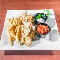 Grilled Chicken Quesadilla  · Pico de gallo, shredded Monterey Jack and cheddar cheese and sour cream and fresh salsa in h...