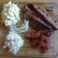 Two Meat Plate  · Choice of 2 meats and 2 sides; includes sliced bread, sauce, and bag of pickles & onions