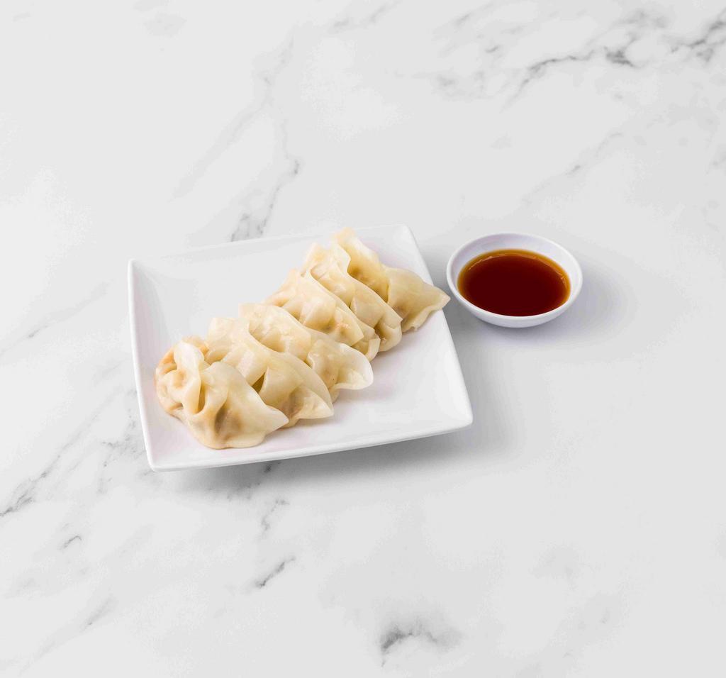 Gyoza · Pan-fried dumplings filled with pork and vegetables, served with dumpling sauce.