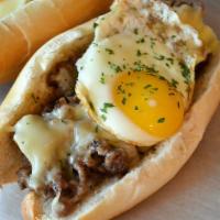 Steak Eggs and Cheese Hero · Steak, eggs and your choice of cheese. Comes with peppers & onions on a toasted hero