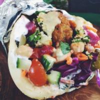 Falafel Sandwich   · Falafel let tomato white sauce on wrap 