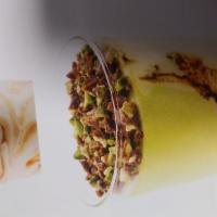 Coppa pistachio · Custard gelato swirled togather with chocalte and pistachio topped with praline pistachios s...