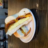 Bacon Egg Cheese Bagel · Ooegy, gooey, sharp cheddar cheese, bacon, and house- made eggs melted onto one of our bagel...
