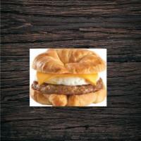 Sausage, Egg, and Cheese Croissant · Sausage patty, cheddar cheese, and egg, all served on a flakey, delicious croissant! 