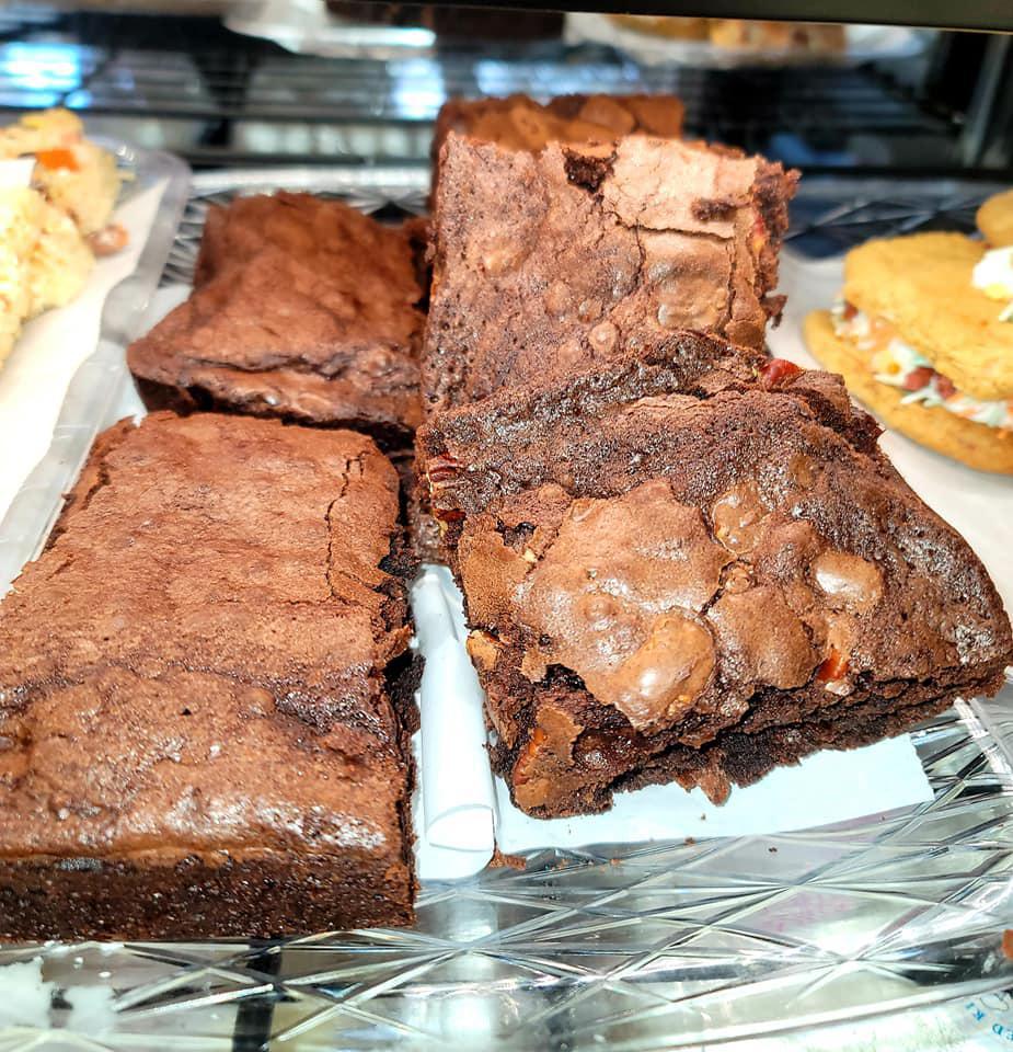Chocolate Fudge Brownie · This brownie is chunk-full of chocolate pieces and is full of rich fudge gooey chocolate. Baked to perfection. A huge serving that can last you a few meals! Over an inch thick ! It's completely addictive!