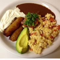 Desayuno Tradicional · 2 eggs, fried ripe plantains, refried red beans, Salvadorian sour cream, Salvadorian cheese,...