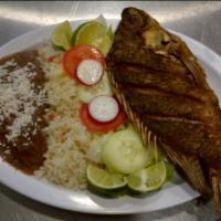 Pescado Frito · Fresh deep-fried tilapia. Served with rice, house salad, refried beans and 2 handmade tortil...