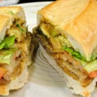 Torta · Toasted bread or bolillo served with beans, cheese, lettuce, tomatoes,onion and avocado. Sid...