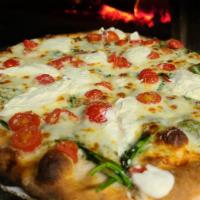 Prima Vera Pizza · Touch of garlic, spinach, tomatoes, cheddar, provolone, and mozzarella cheese. Topped with R...