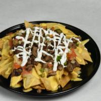 Nachos Ricos · Choice of Meat ( Chicken or Beef only)
Includes refried beans, pico de gallo, sour cream, ch...