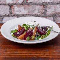 Beets Salad · Roasted red beets, fresh pear, pistachio nuts and goat cheese