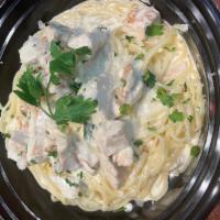 Fettuccine con Grill Chicken · Fresh Pasta in a light cream sauce with Grill chicken and a touch truffle oil.