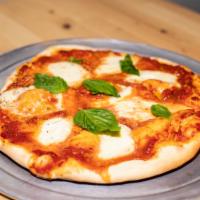 Margherita · Tomato sauce, fresh garlic, oregano, fresh basil, mozzarella, parmesan, olive oil