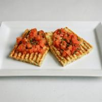 Tomato Basil Bruschetta · Toasted and garlic rubbed Italian bread, topped with diced tomato and fresh basil, EV olive ...