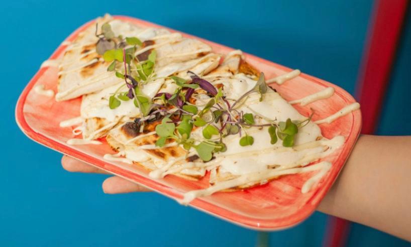 Carne Asada Quesadilla · 48 hour marinated flank steak served with 8 in flour tortilla along with Oaxaca cheese, and roasted garlic-jalapeno sauce.