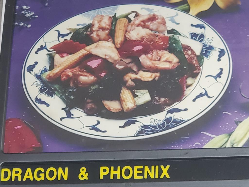 10. Dragon Meets Phoenix Spe · Chunks of shrimp, sliced white meat chicken, red and green pepper, baby corn and black mushroom in delicious sauce.