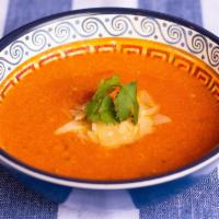 Creamy Tomato Soup · Pureed tomato and cream soup.