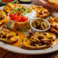 PAPA Nachos 1/2 Order · Potato skins topped with chile con queso, guacamole, sour cream
and jalapenos. Grilled chic...