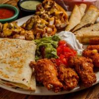 Fiesta Platter · Quesadilla, papa nachos, chicken wings, flautas and stuffed
jalapenos.
