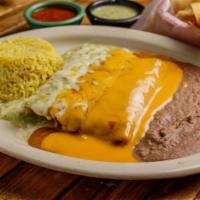 Ground Beef Enchilada (2) · Two beef enchiladas smothered with our traditional chili gravy
with melted cheese.