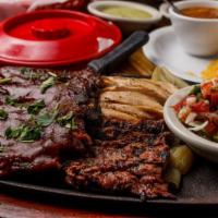 Fajitas / Ribs (1) · Your choice of beef, tender strips of grilled chicken and slow
cooked baby back ribs.