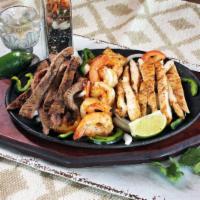 Parrillada (1) · Beef, grilled chicken and jumbo shrimp marinated in a blend of
Cilantro's spices, sauteed f...