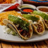 Tres Amigos Tacos · (1) Beef taco, (1) Chicken Taco, (1) Shrimp Taco. Served with
rice, charro beans, cilantro,...