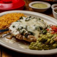 Pollo Monterrey · Grilled chicken breast topped with sauted fresh mushrooms,
onions and bell peppers, smother...