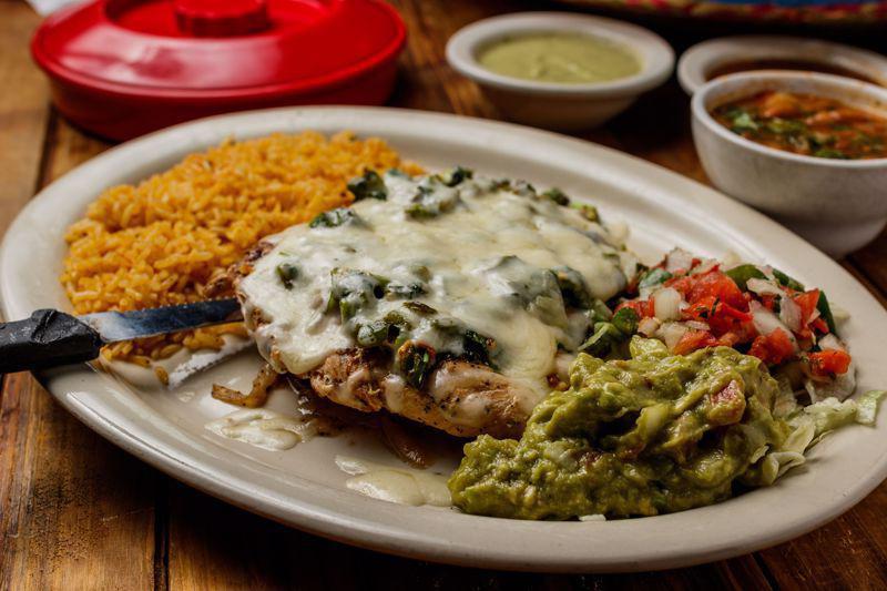 Pollo Monterrey · Grilled chicken breast topped with sauted fresh mushrooms,
onions and bell peppers, smothered with melted cheese.
