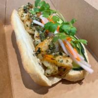 Spiced Chimi Shrimp Banh Mi Sandwich · Shrimp marinated in spiced chimi. Served on a toasted hero roll and mayo spread. Garnished w...