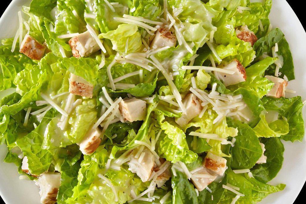 Caesar Salad · Crisp romaine lettuce, croutons, shredded parmesan cheese.