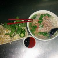 Brisket Pho · A popular vietnamese beef noodle soup. Served with Basil, bean sprouts, jalapeno, lime, onio...