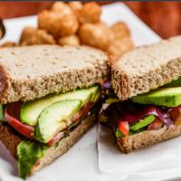 AGT Sandwich · Avocado, greens and tomato with vegan garlic aioli on whole wheat bread. Add veggie bak'n fo...