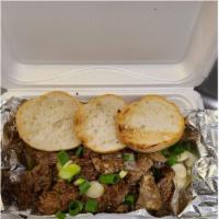 Steak Bites · Small bites of beef steak served with blue cheese, zip sauce, green onions and toasted Frenc...
