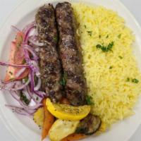 Shish Kafta · Seasoned ground beef or chicken with tomatoes, onions, pickles, and tahini sauce.