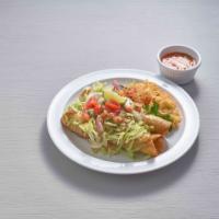 Chimichangas Deluxe · 2 chimichangas (fried or soft) filled with your choice of beef or chicken, topped with chees...