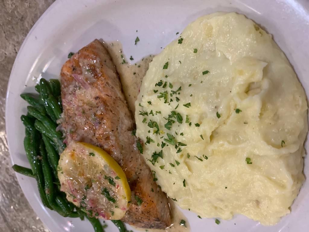 Grilled Salmon · Served with sautéed broccoli and home mashed potatoes topped lemon butter sauce 