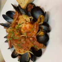 Seafood Pasta · Shrimp, calamari, mussels, & chopped clams cooked in marinara sauce with pasta