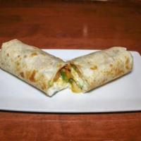 King Burrito · A large flour tortilla filled with beans, lettuce, tomato, sour cream, cheese, and your choi...