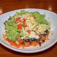 Burrito Bowl · A deconstructed burrito without the tortilla served in a bowl filled with rice, lettuce, tom...