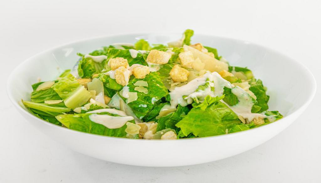  Caesar Salad ·  Crisp romaine lettuce with garlic croutons, Parmesan cheese, and Caesar dressing.