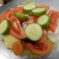 Peter's Garden Salad · Fresh cut iceberg lettuce, tomatoes, English cucumber, radishes, carrots, green peppers, and...